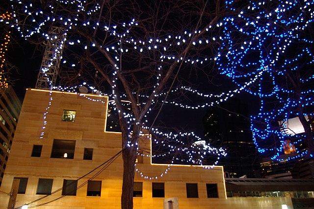 A photo of Nicollet Mall at night with Christmas lights strung up and lit.